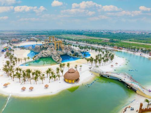 an aerial view of the water park at the disneyland resort at Apartment 1BR-FL22th-R103 Building-Vinhome Ocean Park in Hanoi