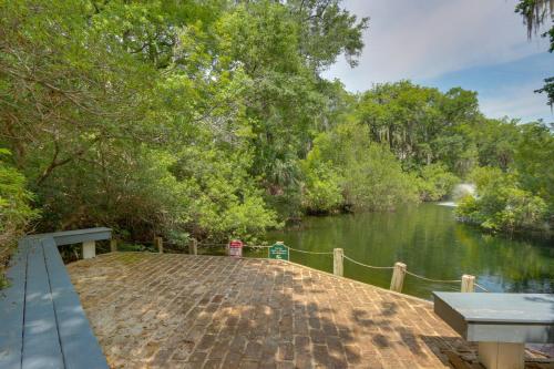 a dock with a view of a river at Serene Hilton Head Island Condo with Community Pool! in Hilton Head Island