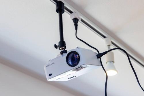 a camera hanging from a ceiling at 庭付き一棟貸 ビーチまで3分 宇利島車で7分 最大8人 Luana house in Nago