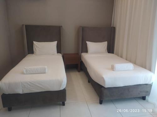 Säng eller sängar i ett rum på Salalah Beach Villas
