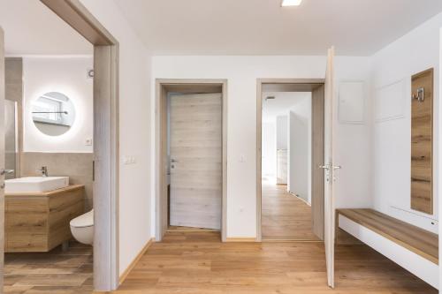 a bathroom with a toilet and a sink at Chic Apartments with Finnish Sauna and Jacuzzi in Kranjska Gora
