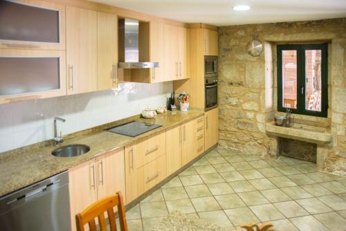 A kitchen or kitchenette at CASA BELAI
