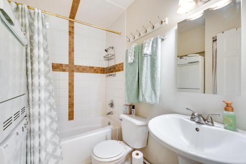 a bathroom with a sink and a toilet and a tub at Beautiful Boulder Townhome Walk to CU and Pearl St! in Boulder