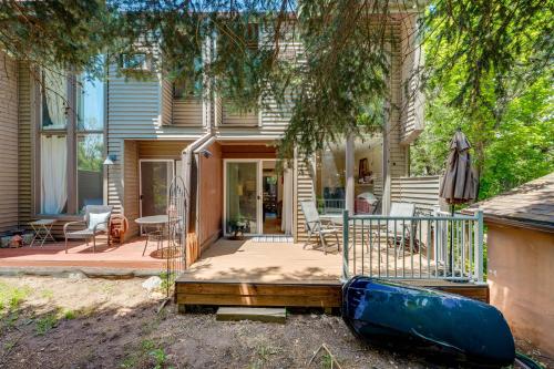 a house with a blue kayak in front of it at Beautiful Boulder Townhome Walk to CU and Pearl St! in Boulder