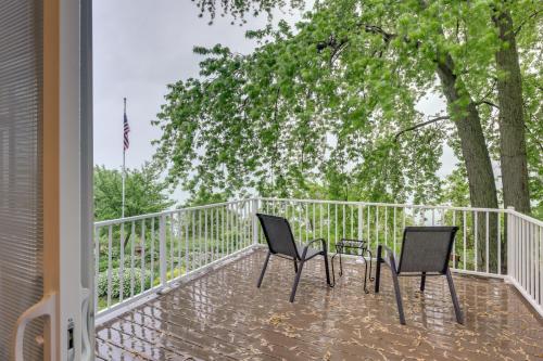 two chairs and a table on a balcony at Sheboygan Getaway with Deck and On-Site Lake Access! in Sheboygan