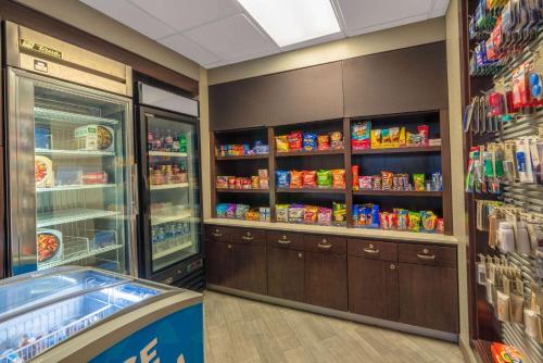 a grocery store with a refrigerator and lots of food at La Quinta by Wyndham Pueblo in Pueblo