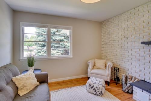 a living room with a couch and a chair at Modern Rapid City Vacation Rental with Deck in Rapid City