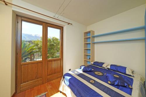 Кровать или кровати в номере Villa Fior di Loto