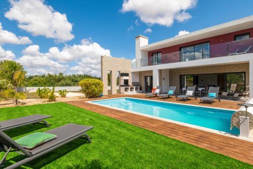 an image of a house with a swimming pool at Casa do Pomar, Piscina Privada, Prainha Alvor! in Alvor