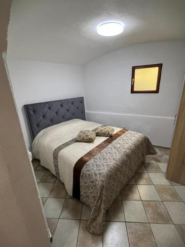 a bedroom with a large bed in a room at Apartment Kotor Old Town in Kotor