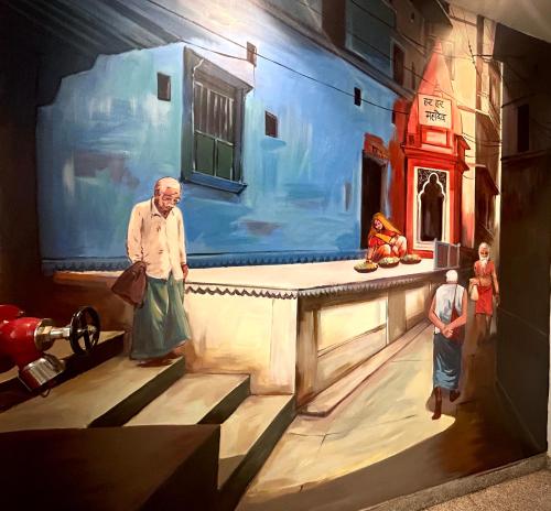 a painting of a man standing in front of a building at Sugar Stars Inn in Varanasi