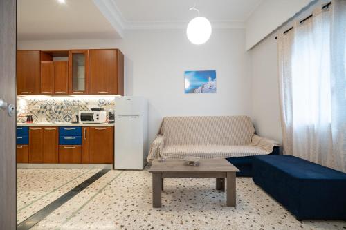 a living room with a couch and a table at Piraeus port 1 bedroom 2 persons apartmet by MPS in Piraeus