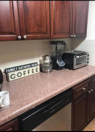 a kitchen counter with a toaster and a coffee maker at Crown Heights Gem in Brooklyn