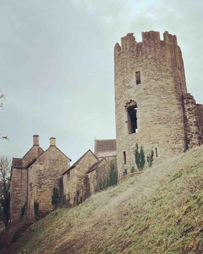 an old castle on top of a hill at The Rumple Hut in Wingfield