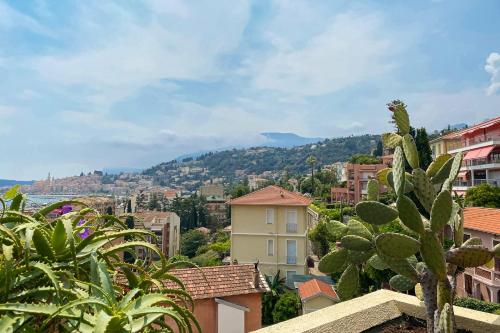 a view of a city with houses and trees at Mansfield vue carte Postale Terrasse Piscine calme port à 200m à pied in Menton
