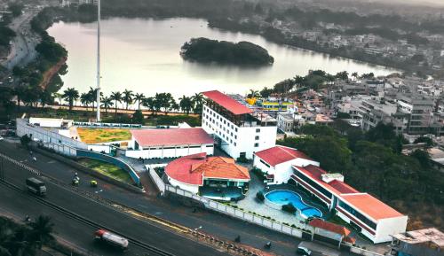 an aerial view of a building next to a river at Mayur Belgaum Presidency Hotel & Spa in Belgaum