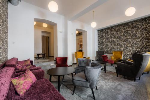 a living room with a couch and chairs and a table at EA Hotel Victoria in Prague