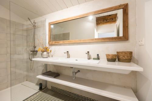 a bathroom with a sink and a mirror at La Bergerie in Argelès-sur-Mer