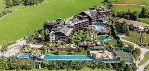an aerial view of a mansion with a swimming pool at Andreus Resorts in San Leonardo in Passiria