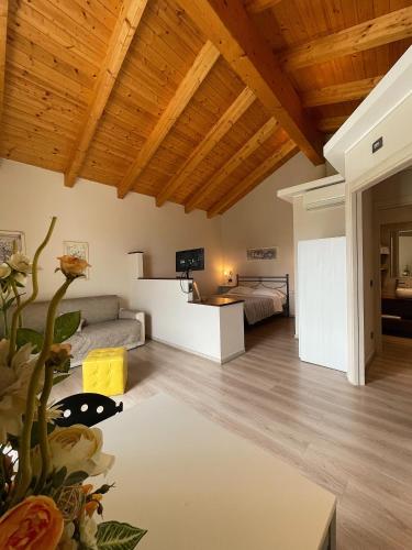 a living room with a couch and a table at La Rocca in Carrù