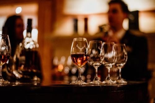 a group of wine glasses sitting on a table at Links House at Royal Dornoch in Dornoch