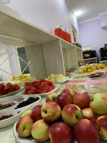 a bunch of food on a table in a kitchen at Grand Avenue Hotel in Tashkent