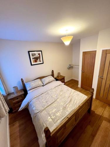 a bedroom with a large bed in a room at One Bedroom Apartment in Bangor in Bangor
