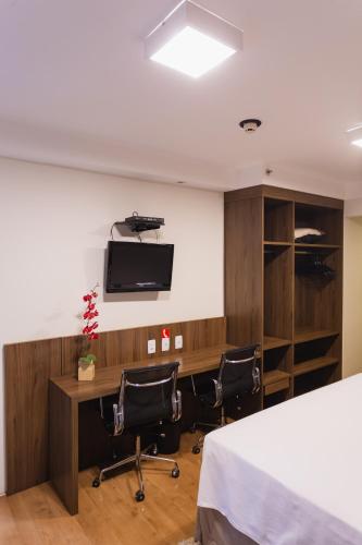 TV a/nebo společenská místnost v ubytování JR Hotel Ribeirão Preto
