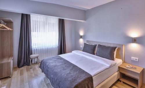 Postel nebo postele na pokoji v ubytování Palmada Hotel