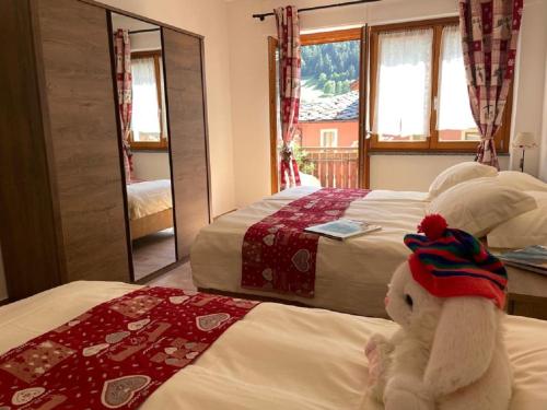 Postel nebo postele na pokoji v ubytování Maison Julie-lungo la via Francigena