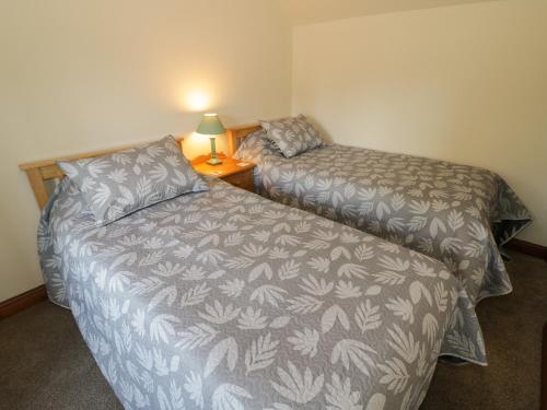 Ένα ή περισσότερα κρεβάτια σε δωμάτιο στο Avoine Cottage