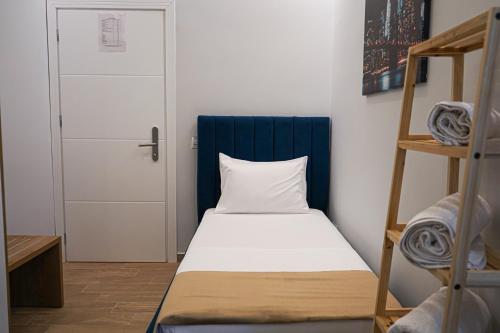 a small room with a bed and a ladder at DelMar Apartments in Golem