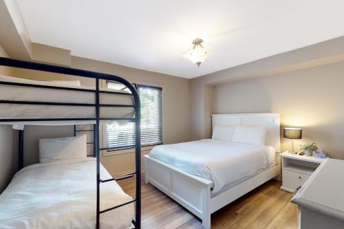 a bedroom with a bed and a bunk bed at Sierra Lane 105 in Blue Mountains