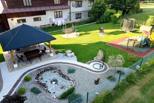an aerial view of a backyard with a playground at Sielanka Apartamenty SPA in Białka Tatrzanska