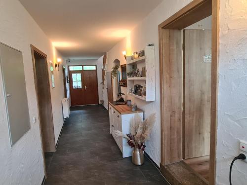 a hallway of a home with a counter and a kitchen at Rosenzauber Gipfelstürmer in Weißenstadt