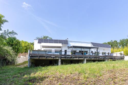 a house on a dock in the middle of a field at Etchetao in Boucau