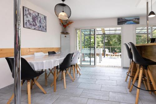 a dining room with a table and chairs at Etchetao in Boucau