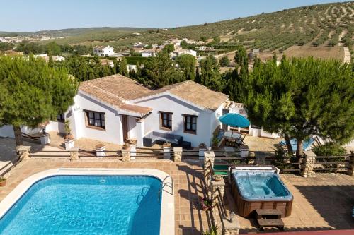 an aerial view of a house with a swimming pool at Pasa Fina, luxury holiday retreat in Villanueva del Trabuco