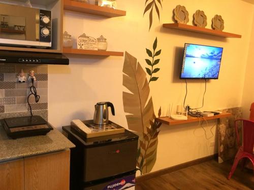 Dapur atau dapur kecil di La Reina Suite Tuscania Towers