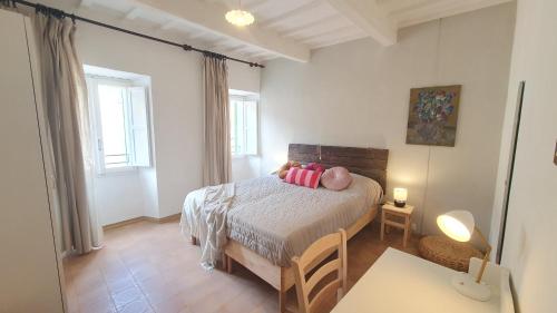 Postel nebo postele na pokoji v ubytování RomagnaBNB Biscanto Townhouse