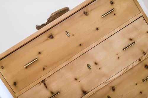 a wooden chest of drawers with metal pulls at Josephus - Domicilium III in Madonna