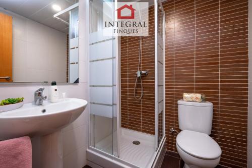 a bathroom with a shower and a toilet and a sink at Sapore di Mare Palamós in Palamós