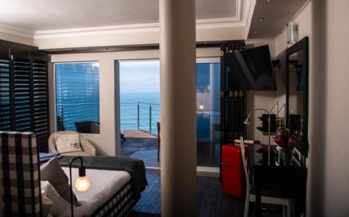 a hotel room with a view of the ocean at Head over Hills in Knysna