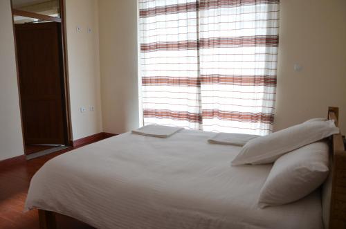 Un ou plusieurs lits dans un hébergement de l'établissement Zan-Seyoum Hotel - Lalibela