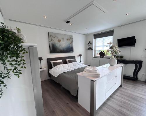 Ένα ή περισσότερα κρεβάτια σε δωμάτιο στο De Kamperveste