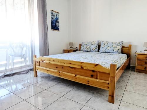 A bed or beds in a room at Athens Cozy Flat for 4