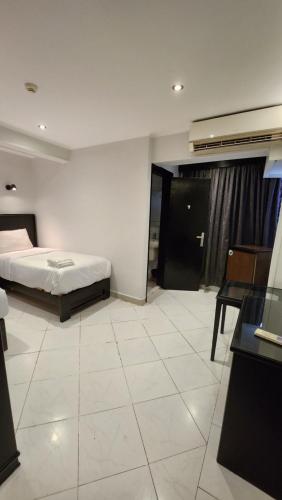 Helio Cairo Hotelにあるベッド