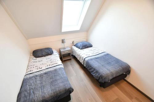 מיטה או מיטות בחדר ב-Reigersberg 10