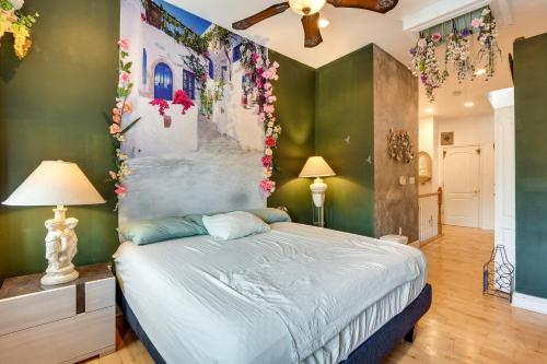 a bedroom with a bed with flowers on the wall at Quirky Baltimore Townhome about 2 Mi to Inner Harbor in Baltimore