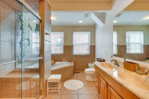 a bathroom with a tub and a toilet and a sink at Quirky Baltimore Townhome about 2 Mi to Inner Harbor in Baltimore